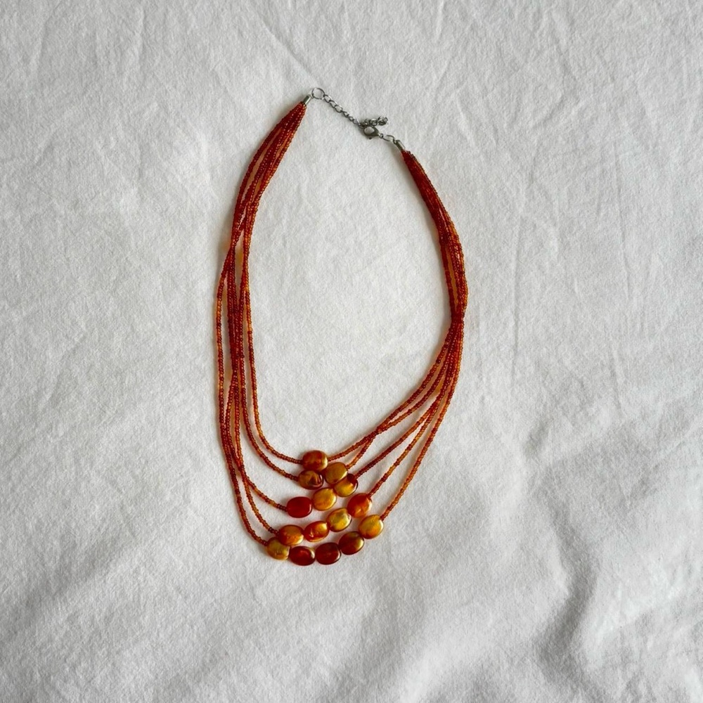 Layered orange beaded necklace